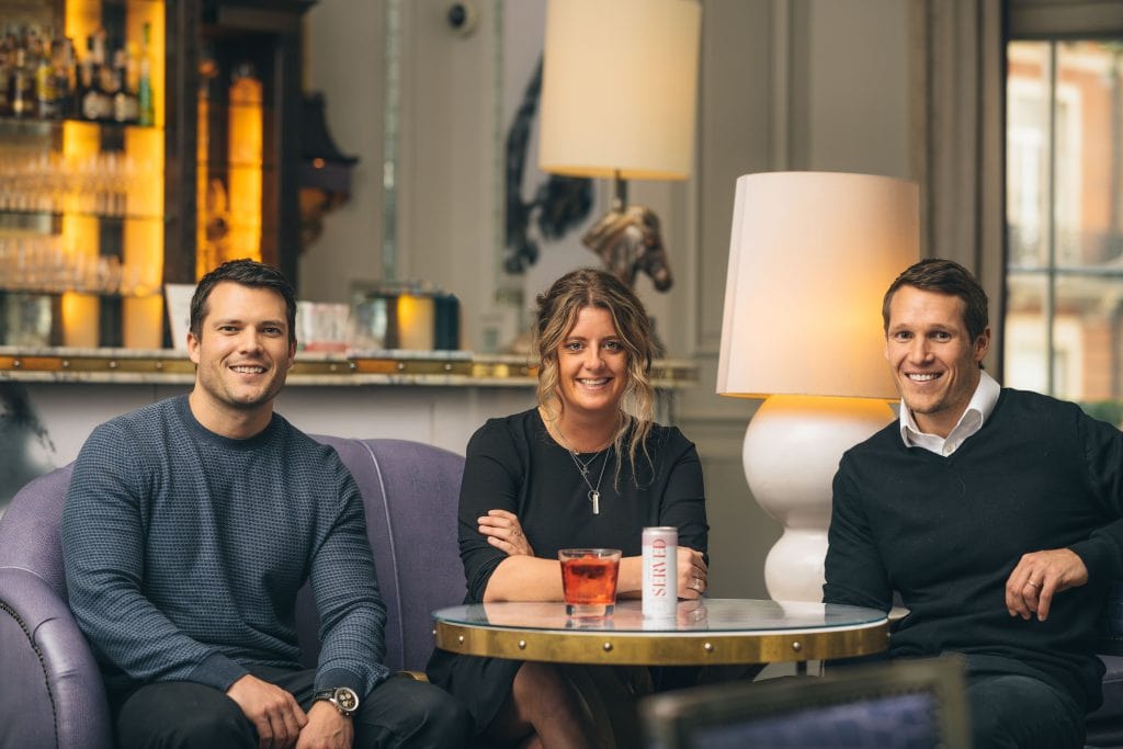 The co-founders of Served with Anna of The Artesian London in a booth at the bar