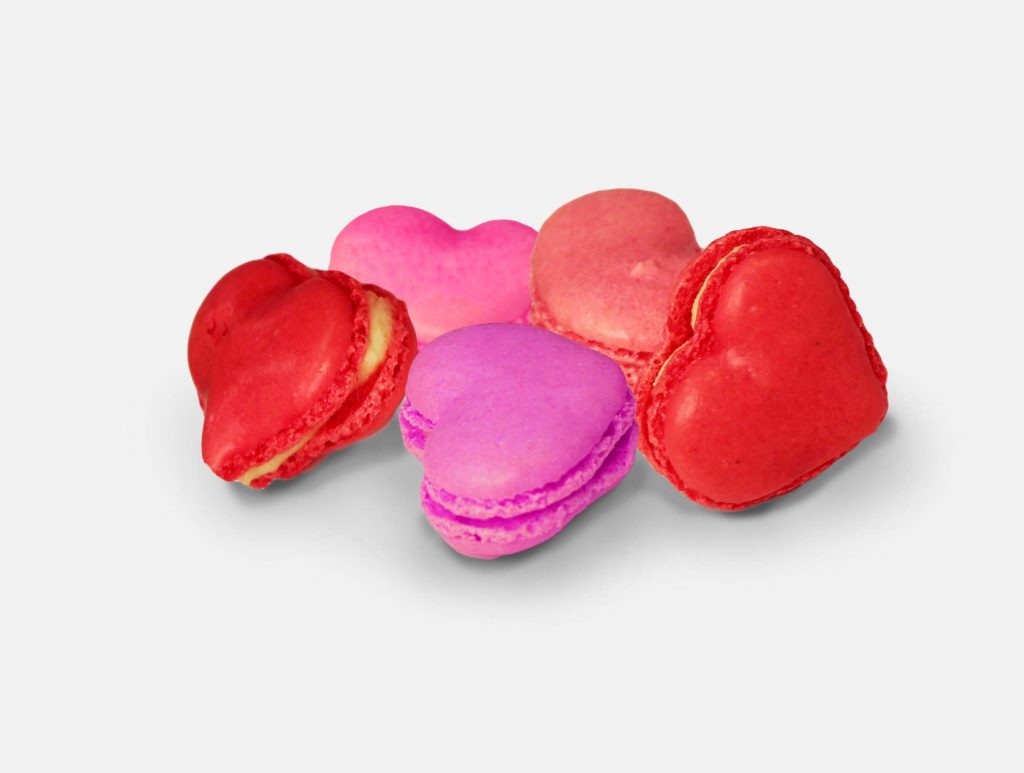 Heart shaped macaroons in red and pink