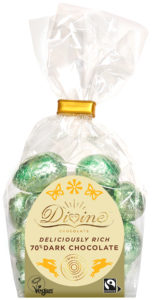 A package of Divine 70% dark chocolate mini eggs in green foil