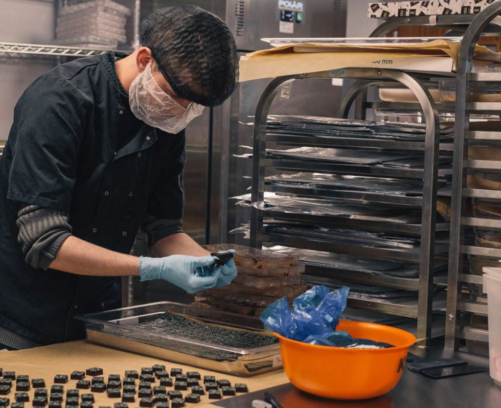 One of Harry Specters employees making chocolates at their HQ