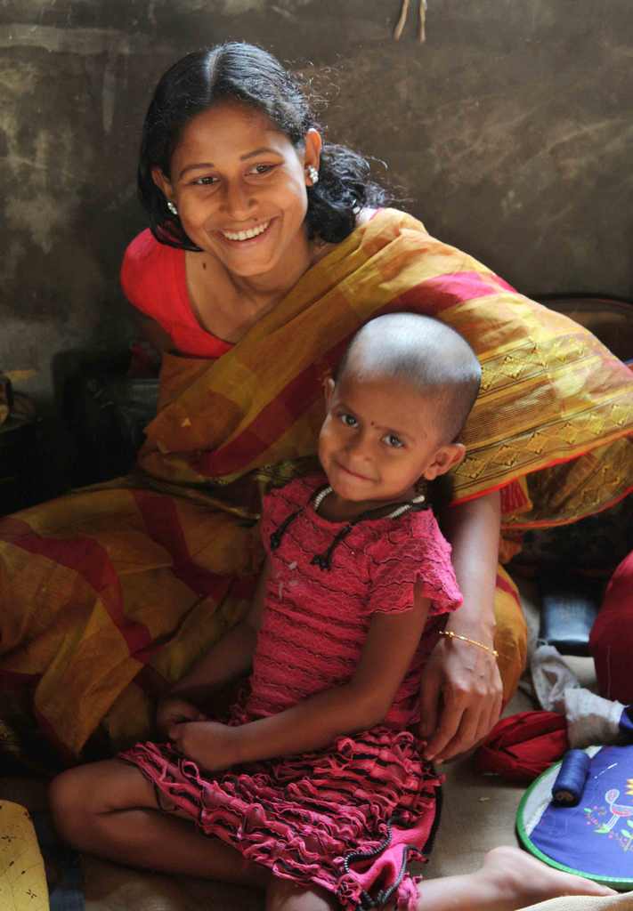 A female artisan with child