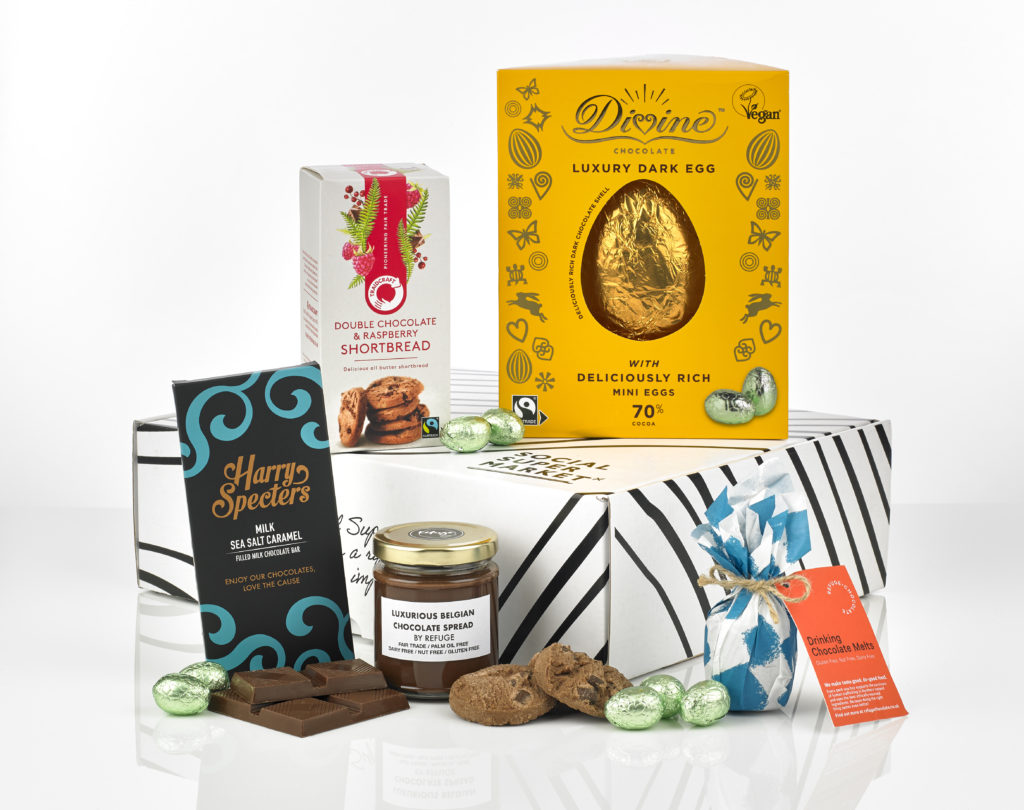 The Easter Chocolicious gift box, open showing its contents around it