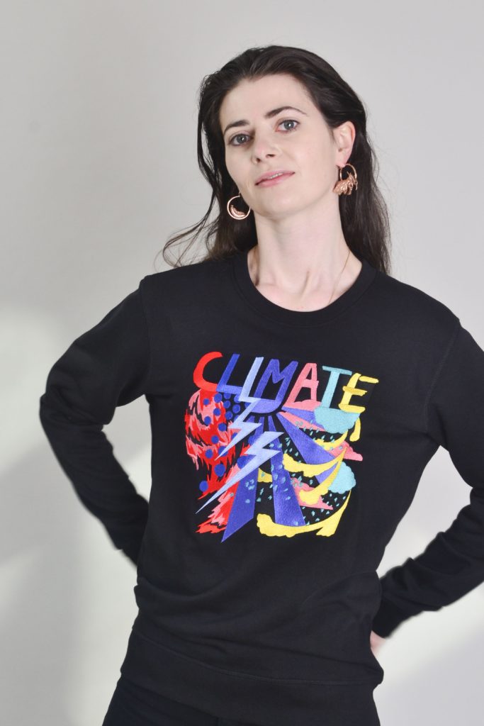 A woman wears the Climate sweatshirt by Gung Ho.