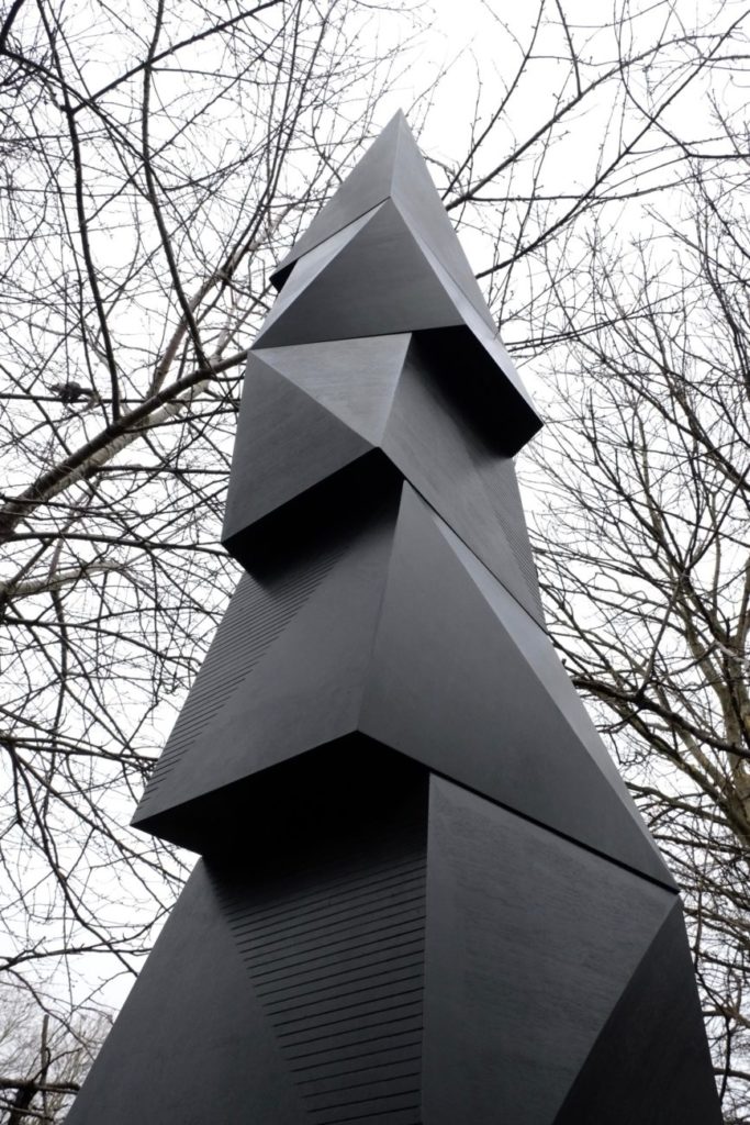 The bat tower by artist DJ Simpson which stands in the Phytology community garden, shot in black and white.