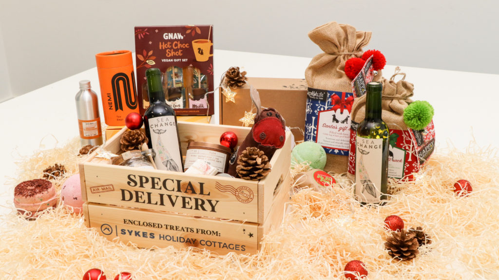 A selection of Christmas goodies, available to win via Sykes Holiday Cottages including Sea Change wine and NEMI Teas spicy chai