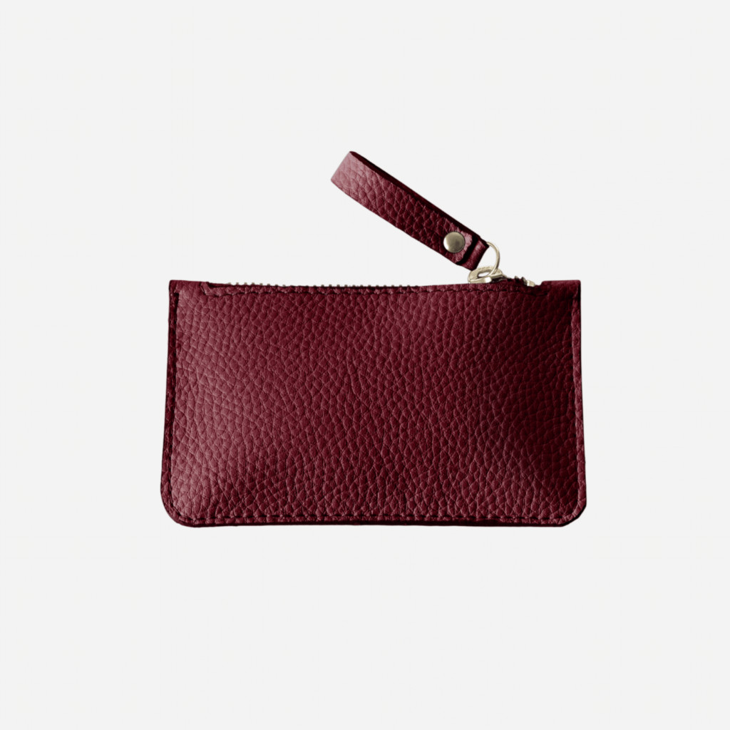 A red wine coloured leather purse with a long zipper