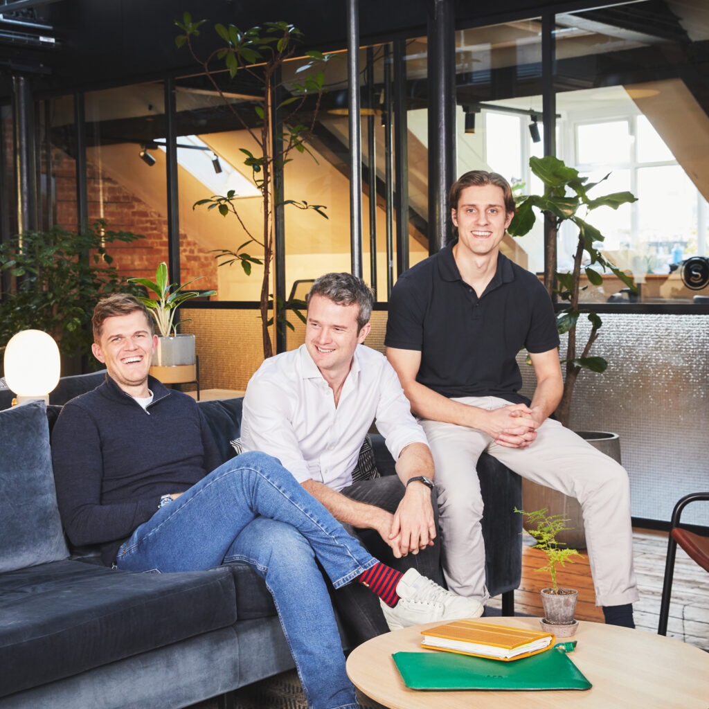 The three cofounders of Social Supermarket in an office environment