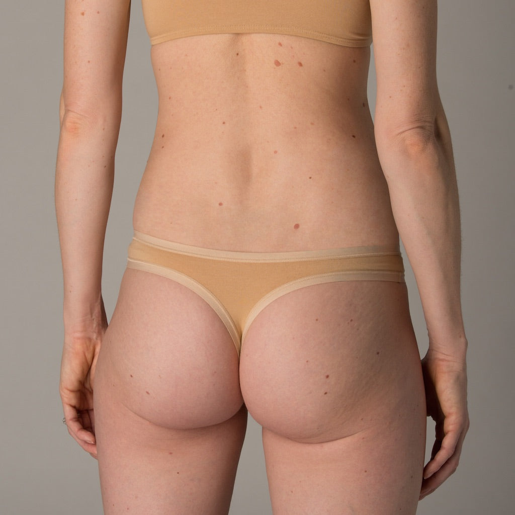Women's organic cotton thong in almond (light nude)